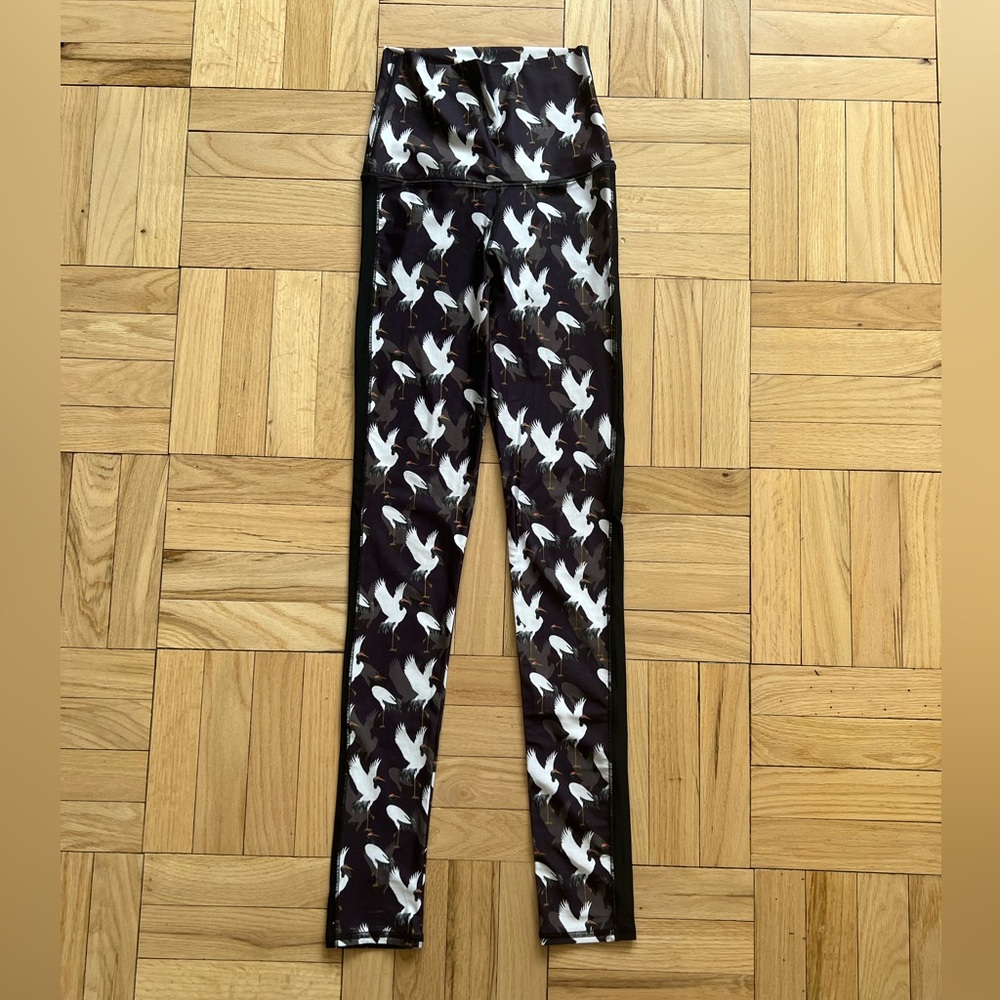 Emily Hsu crane print leggings with black tuxedo stripe down the side. Size S.